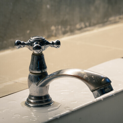 a faucet on the side of a sink